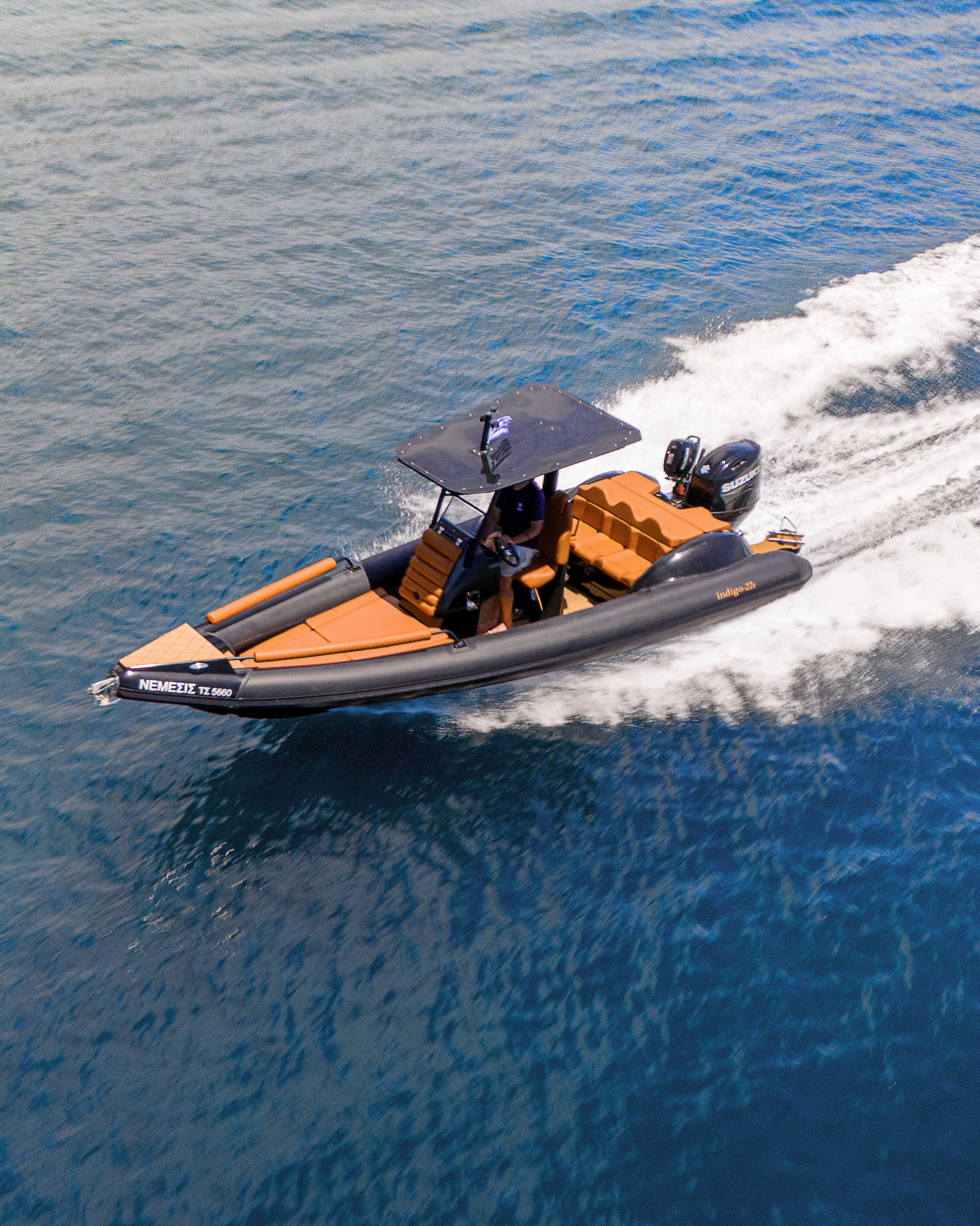 Nemesis RIB boat cockpit with skipper seat and controls in Corfu