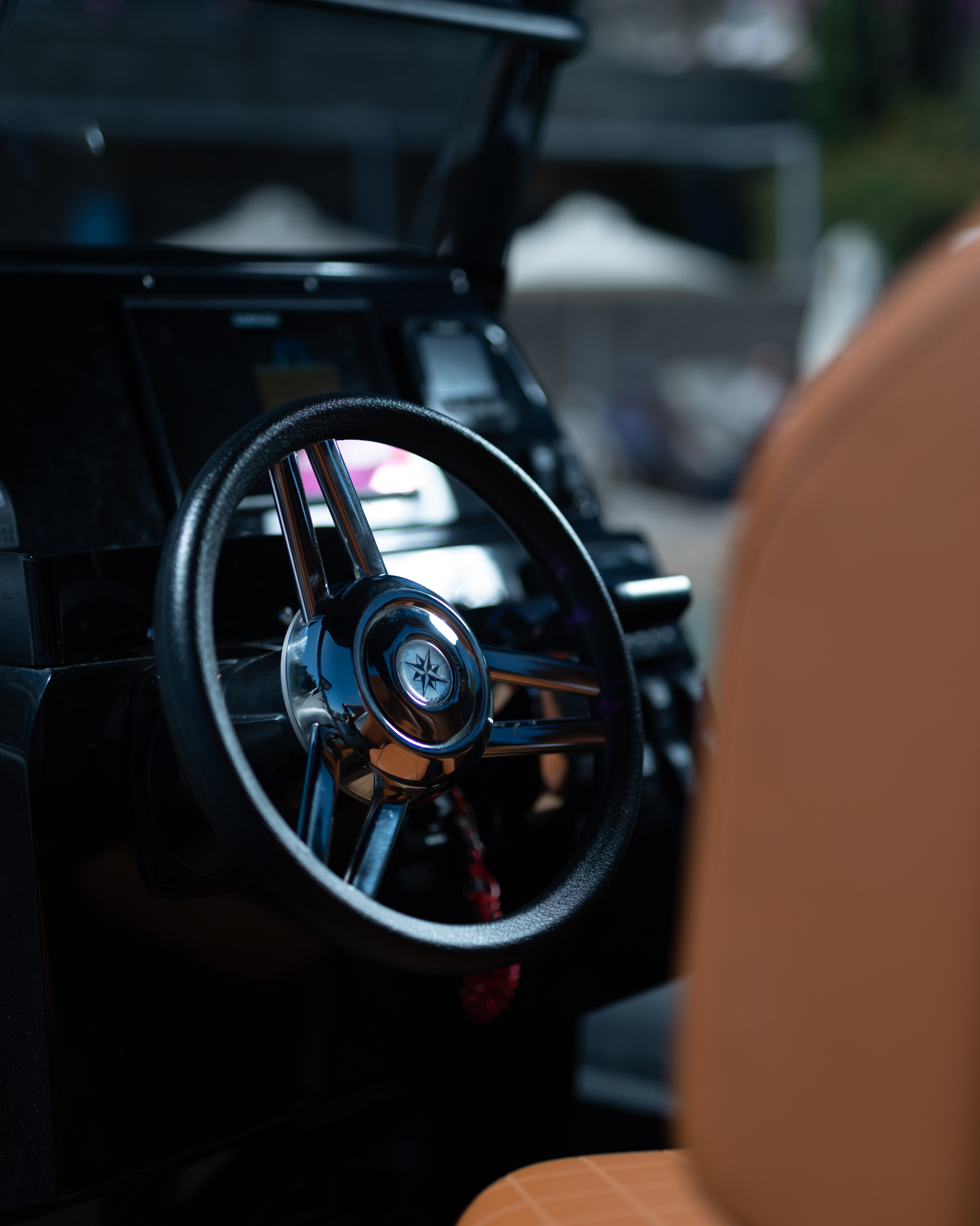 Steering wheel of a vintage car with a blurred background