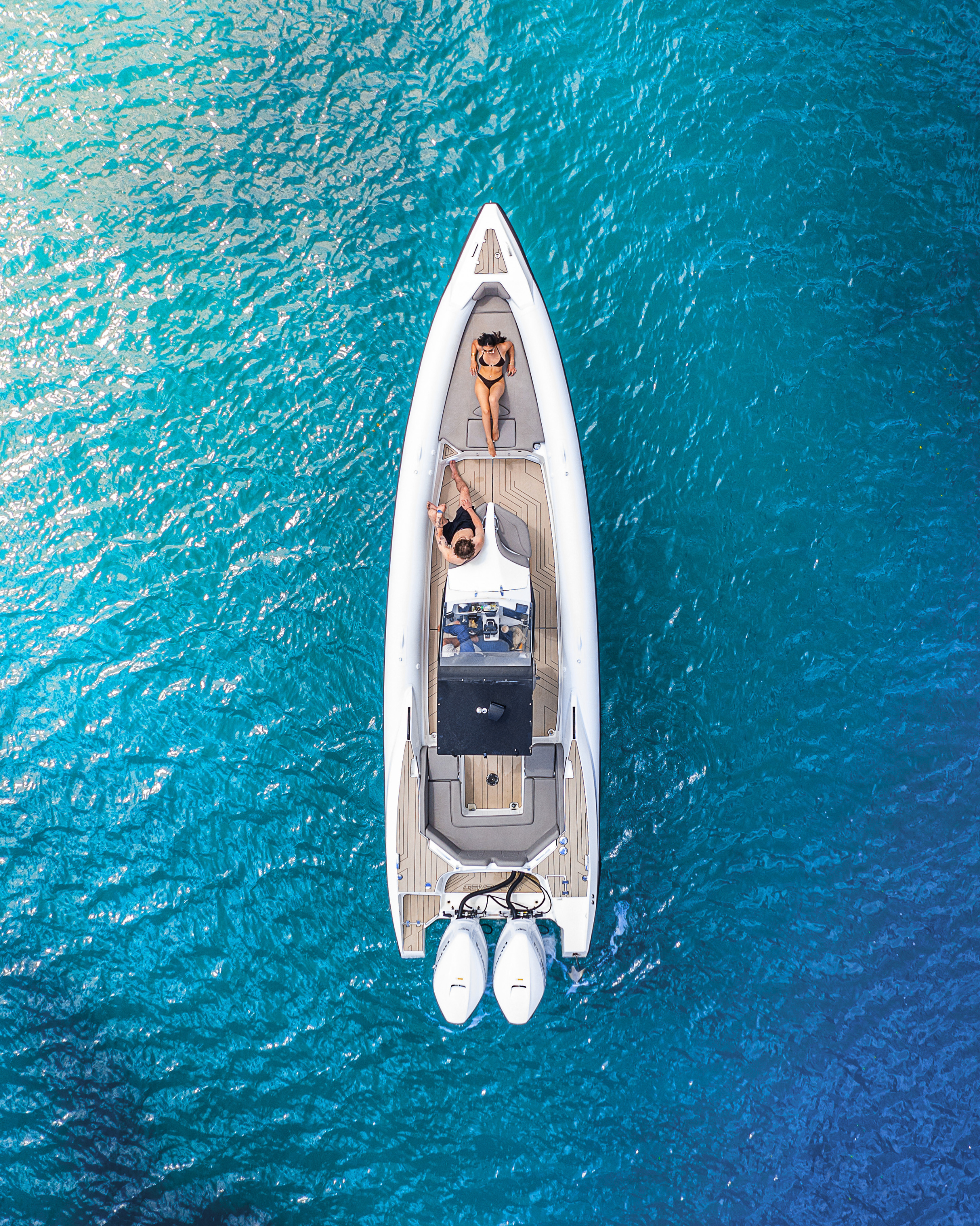 Top-down view of a boat on clear blue water